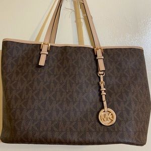 Michael Kors monogram brown leather tote purse.